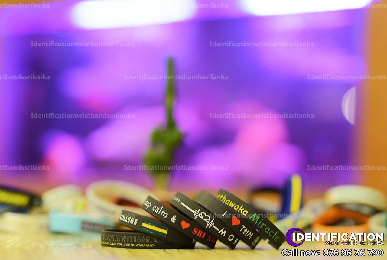 Debossed black silicone identification wristbands, design for school fundraising events in Sri Lanka